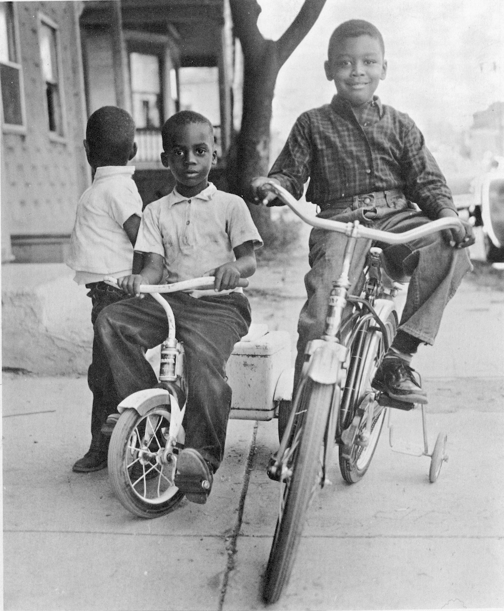 Three young boys riding bikes in the 15th Ward in 1963. 